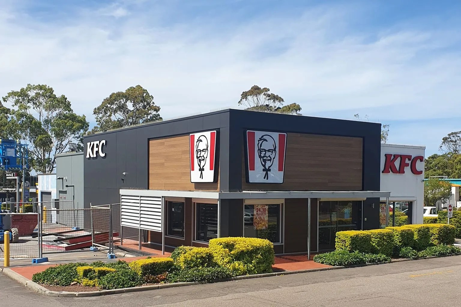 A KFC restaurant located in a parking lot.